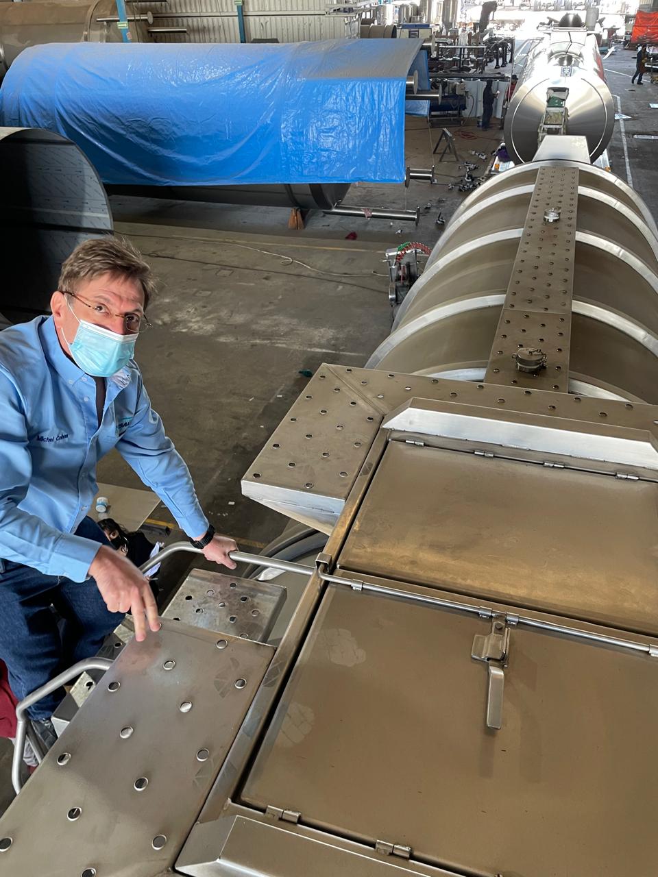 Michel Cohen, CEO of TRESAL, inspecting a stainless steel tank truck