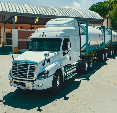 TRESAL tractor truck coupled to stainless steel ISO tank container for intermodal bulk chemical transport in Mexico